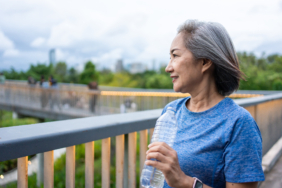 asian-senior-woman-drinking-water-while-running-ex-2026-07-14-04-04-20-utc