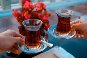 two-hands-holding-glasses-of-turkish-tea-2026-03-13-04-24-18-utc